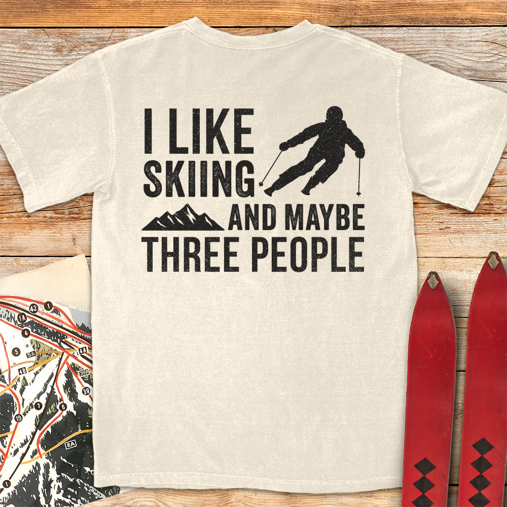 Three People Skiing