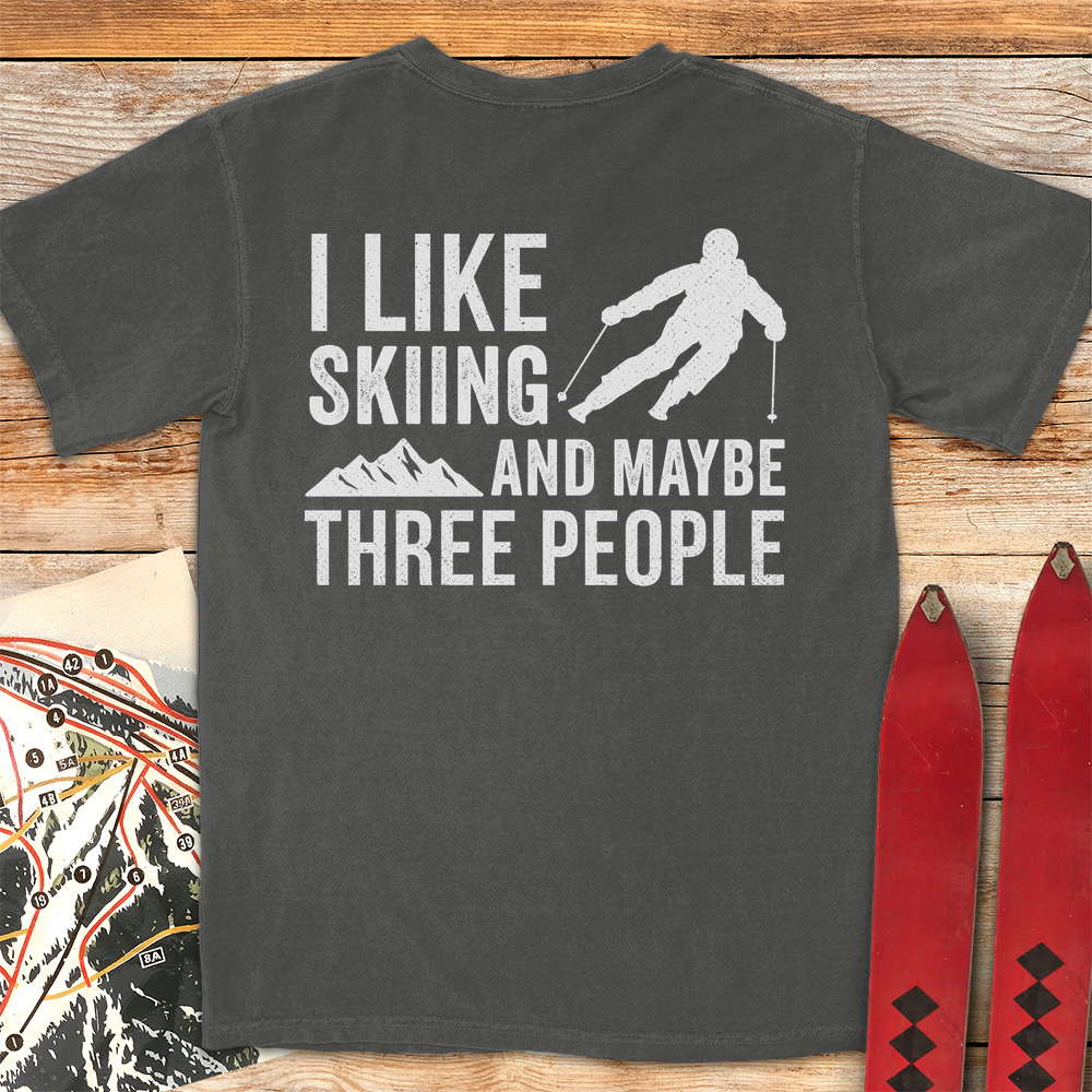 Three People Skiing